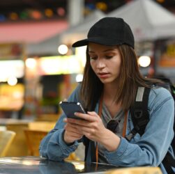 Beautiful caucasian young woman messaging on smart phone