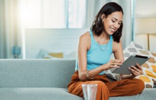 Streaming movies to watch online on digital tablet, watching videos and scrolling on social media w