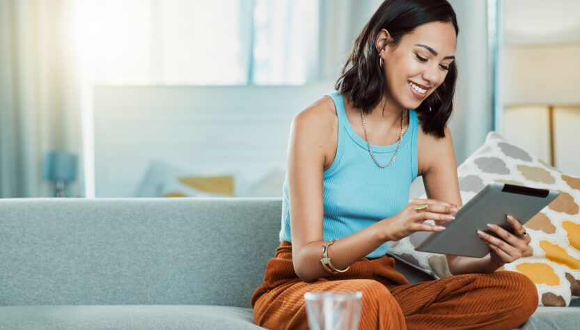 Streaming movies to watch online on digital tablet, watching videos and scrolling on social media w